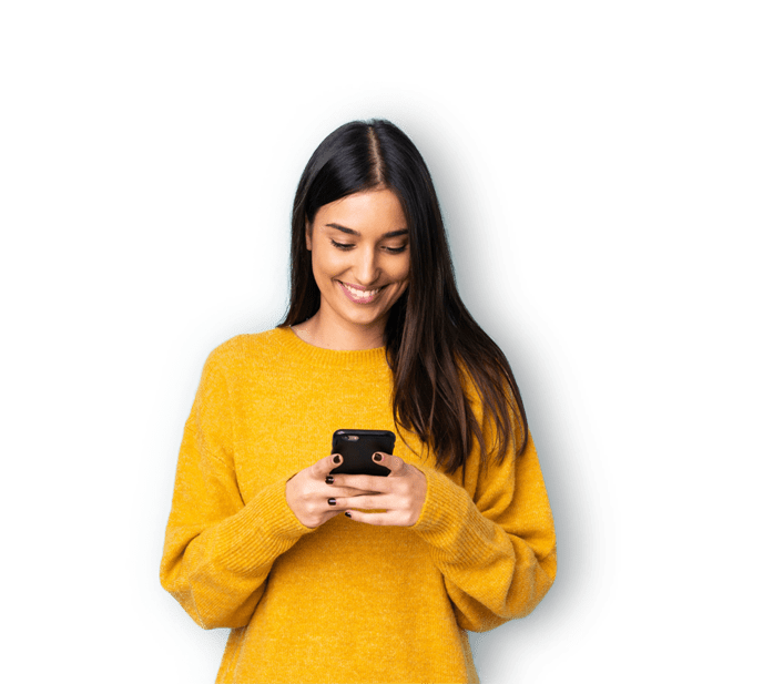 A women in a yellow shirt using her phone.