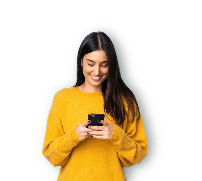 A women in a yellow shirt using her phone.